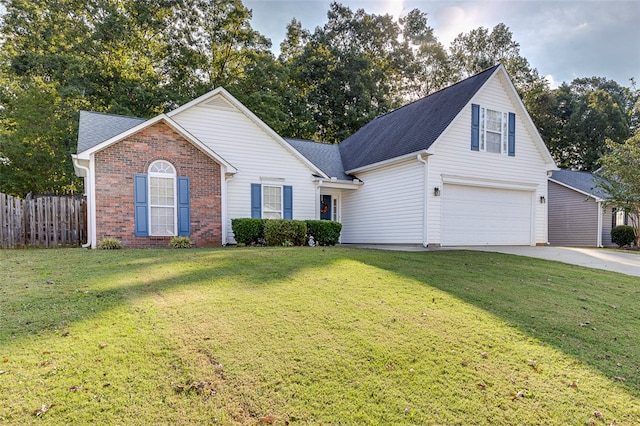 front of property with a front yard and a garage