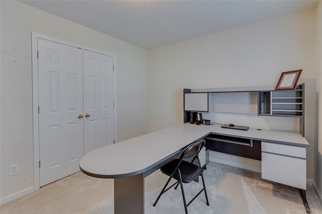 office area featuring light colored carpet