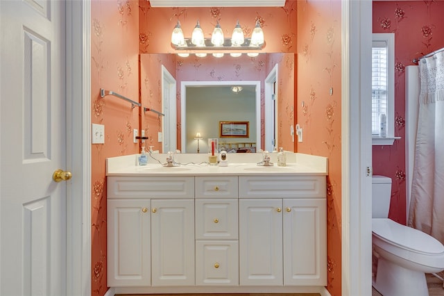 bathroom featuring vanity and toilet