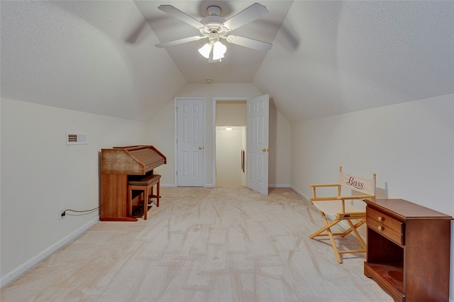 additional living space featuring light colored carpet, vaulted ceiling, and ceiling fan