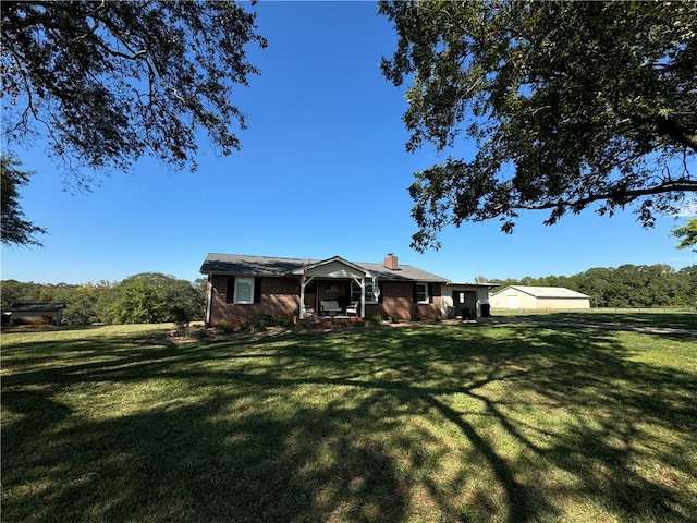 ranch-style home with a front lawn