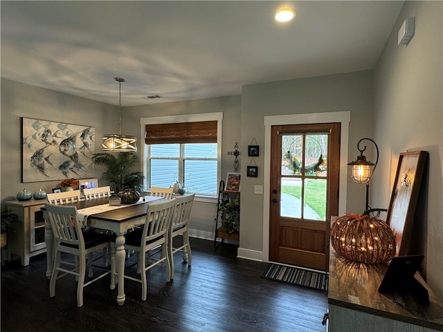 dining area with dark wood-type flooring