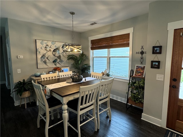 dining room featuring dark wood-type flooring