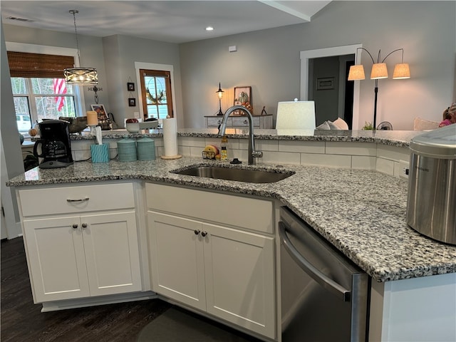 kitchen with dishwasher, dark wood-type flooring, white cabinets, sink, and light stone countertops