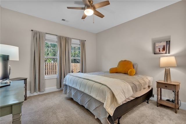 carpeted bedroom with ceiling fan