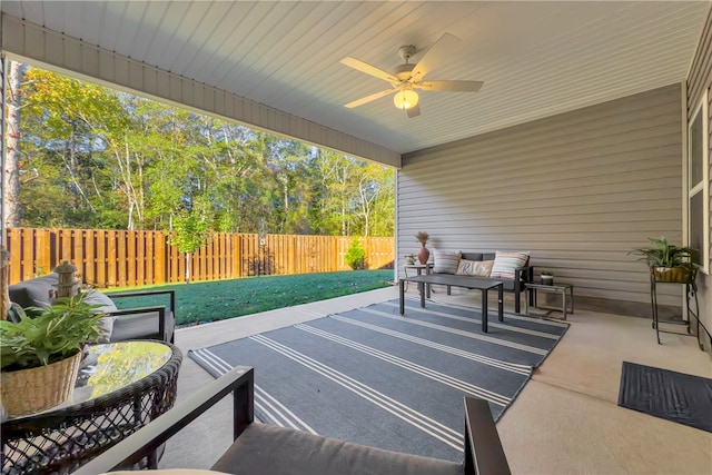 view of patio featuring an outdoor living space and ceiling fan