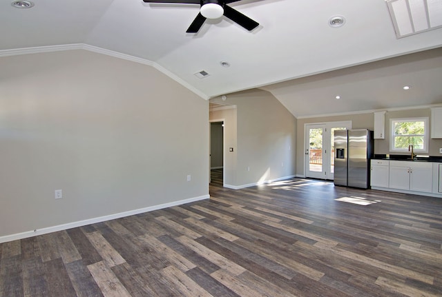 unfurnished living room with ornamental molding, sink, vaulted ceiling, dark hardwood / wood-style flooring, and ceiling fan