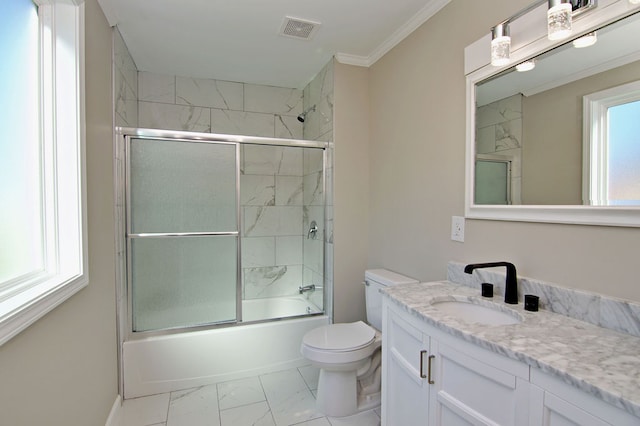 full bathroom featuring vanity, enclosed tub / shower combo, ornamental molding, and toilet