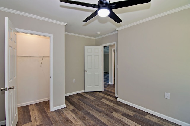 unfurnished bedroom featuring ornamental molding, dark hardwood / wood-style floors, a closet, and ceiling fan