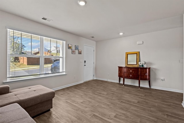 interior space with a healthy amount of sunlight and hardwood / wood-style floors