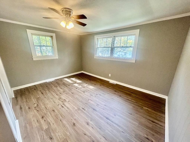 3406 Wilmont St, Anderson, SC 29624 - empty room with crown molding, plenty of natural light, wood finished floors, a ceiling fan, and baseboards