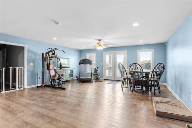 dining space featuring ceiling fan, baseboards, french doors, and wood finished floors