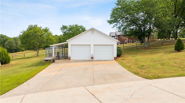 garage with fence and a garage