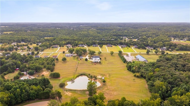 bird's eye view featuring a wooded view