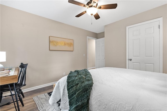 bedroom featuring hardwood / wood-style flooring and ceiling fan