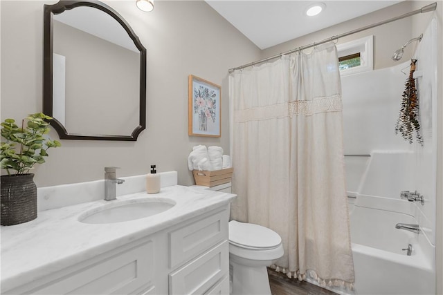 full bathroom with vanity, hardwood / wood-style flooring, toilet, and shower / bathtub combination with curtain