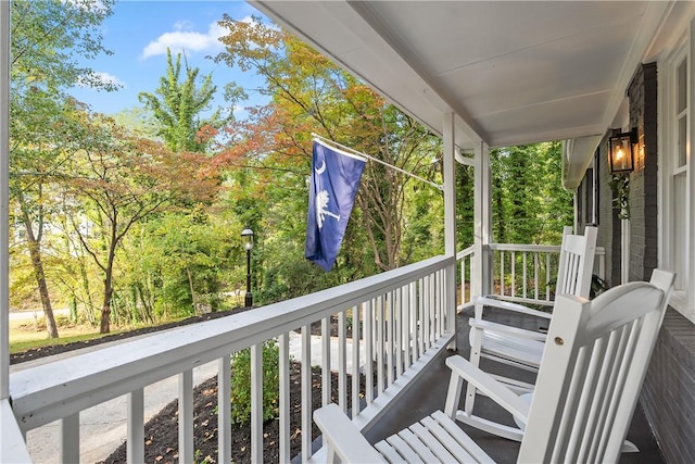 balcony featuring a porch