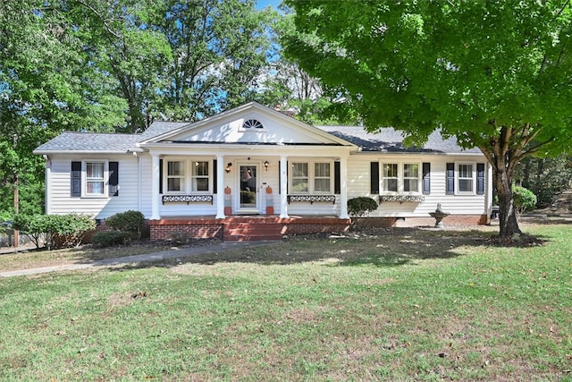 ranch-style house with covered porch and a front lawn