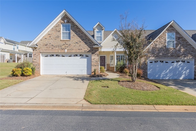 view of front property with a front lawn and a garage