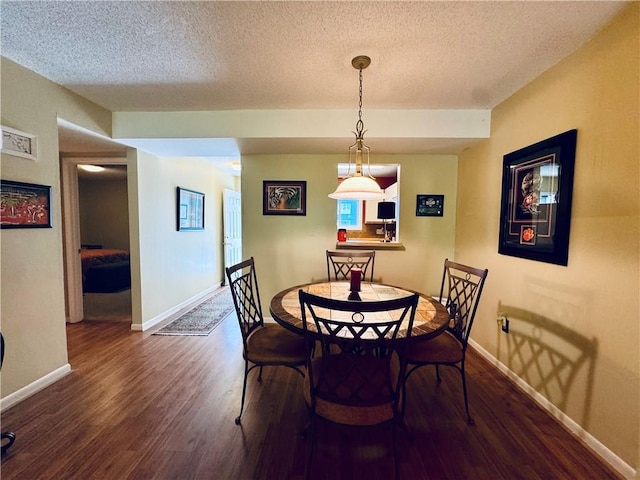811 Northlake Dr, Anderson, SC 29625 - dining area with wood finished floors, a textured ceiling, and baseboards