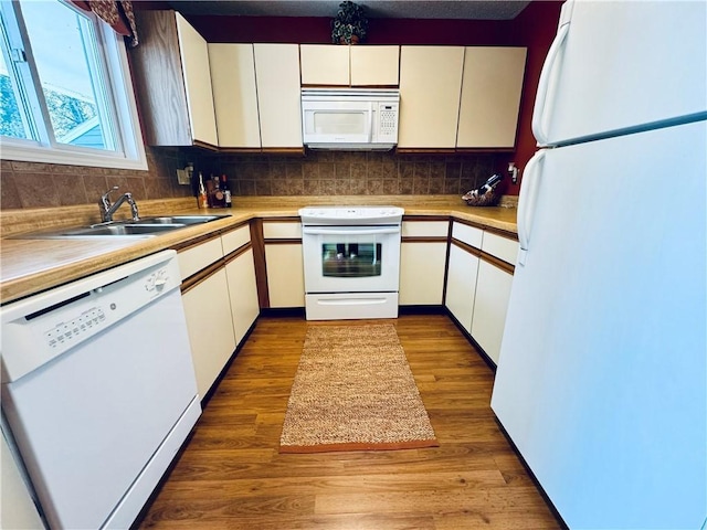 811 Northlake Dr, Anderson, SC 29625 - kitchen featuring white appliances, a sink, decorative backsplash, and light countertops
