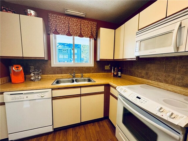811 Northlake Dr, Anderson, SC 29625 - kitchen with white appliances, a sink, light countertops, backsplash, and a textured ceiling