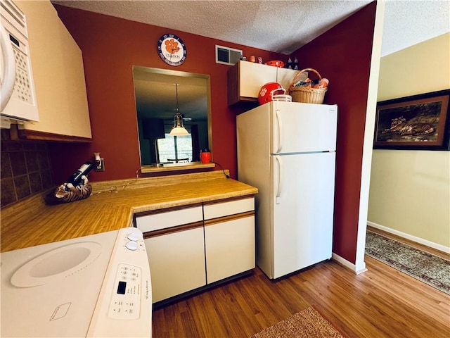 811 Northlake Dr, Anderson, SC 29625 - kitchen with white appliances, wood finished floors, light countertops, a textured ceiling, and white cabinetry