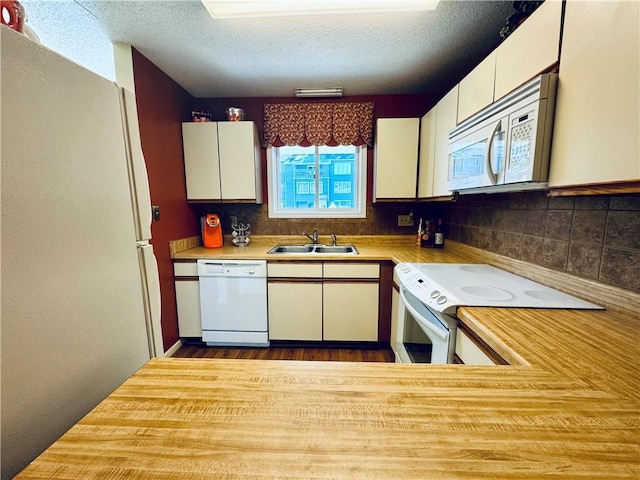 811 Northlake Dr, Anderson, SC 29625 - kitchen with white appliances, a sink, light countertops, decorative backsplash, and a textured ceiling