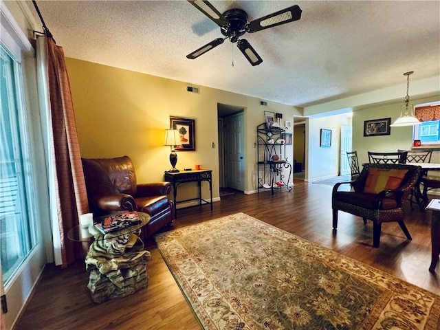 811 Northlake Dr, Anderson, SC 29625 - living area featuring a ceiling fan, a textured ceiling, wood finished floors, and baseboards