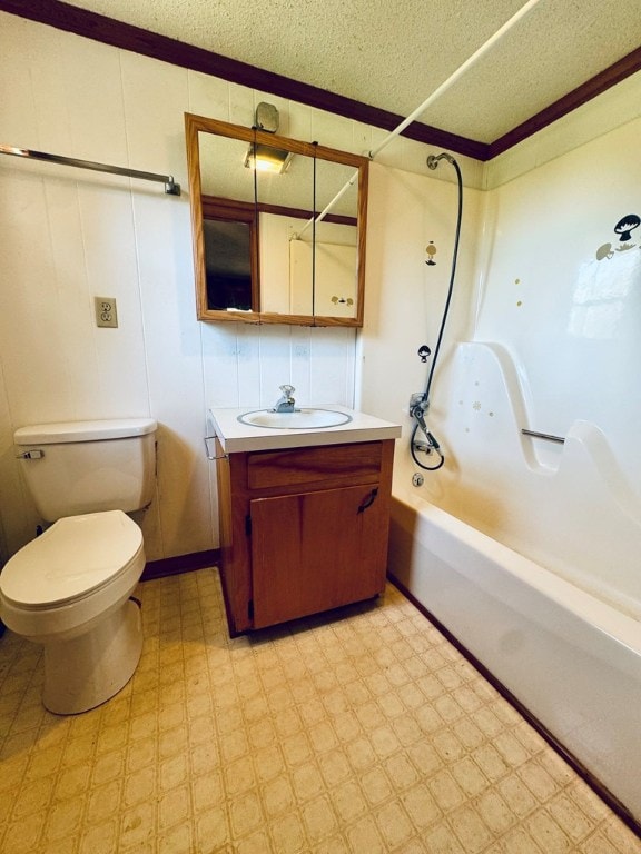 full bathroom with a textured ceiling, toilet, vanity, crown molding, and bathing tub / shower combination