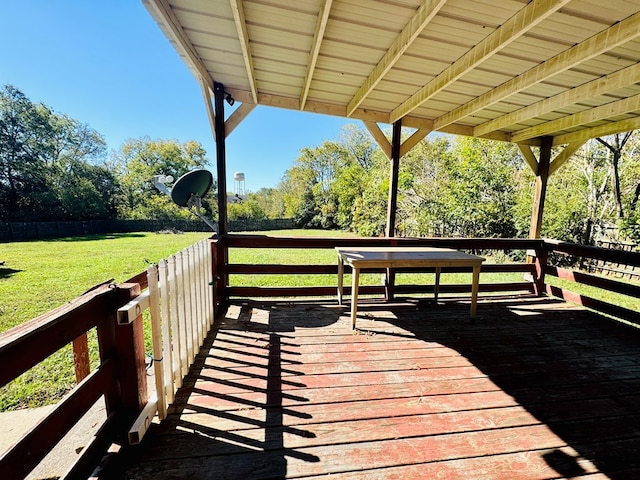 wooden deck with a lawn