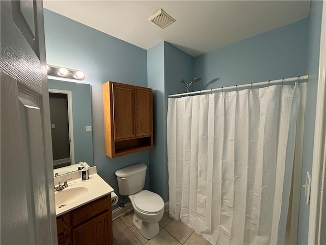 bathroom with toilet, curtained shower, vanity, and tile patterned floors