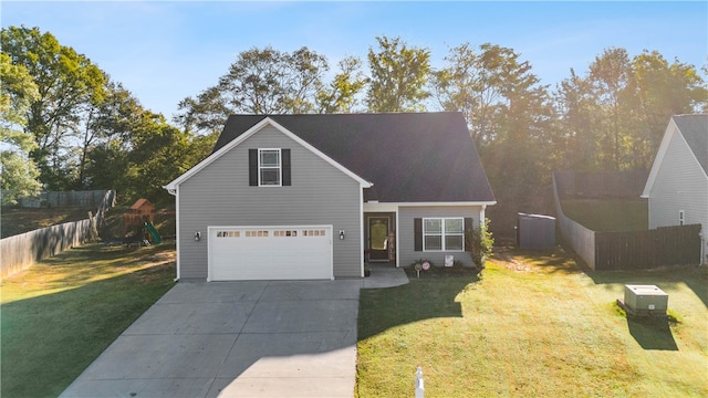 view of property featuring a garage, a playground, and a front lawn