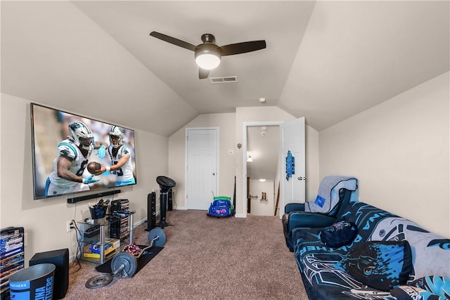 workout room featuring vaulted ceiling, ceiling fan, and carpet floors