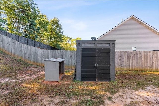 view of property's community with a shed