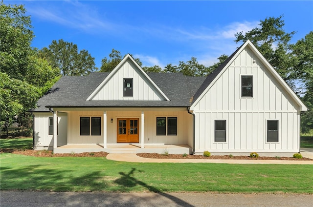 modern farmhouse with a porch and a front yard