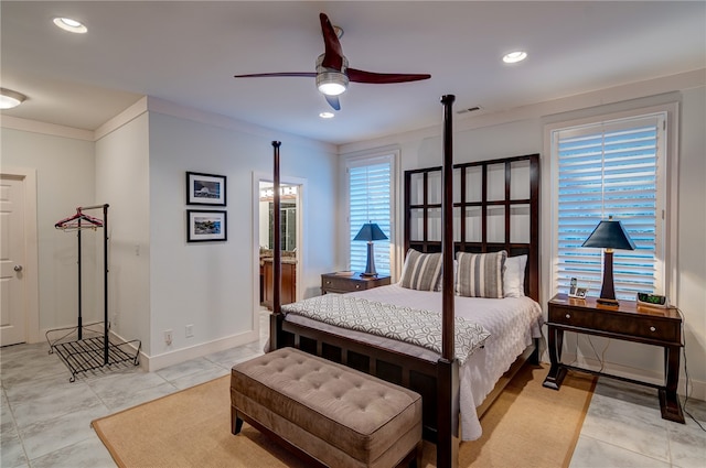 bedroom featuring ceiling fan, crown molding, and light tile patterned floors