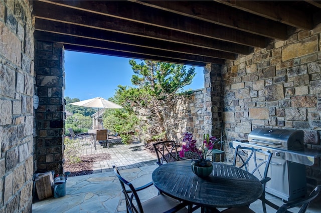 view of patio with a grill