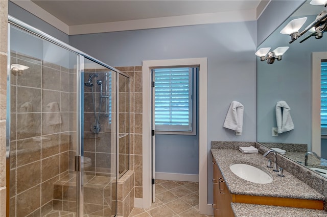 bathroom featuring vanity, tile patterned flooring, and a shower with door