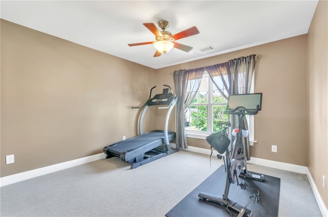 exercise room with carpet flooring and ceiling fan