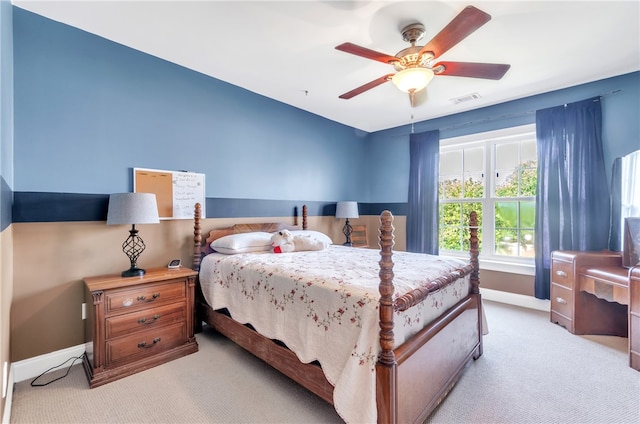 bedroom featuring ceiling fan and light carpet