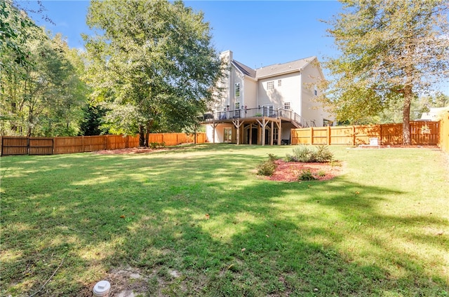 view of yard featuring a wooden deck