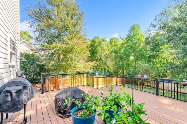 wooden deck with area for grilling