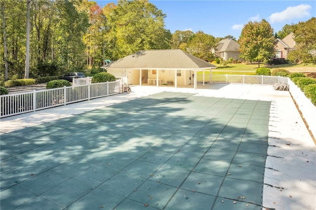 view of swimming pool featuring a patio area