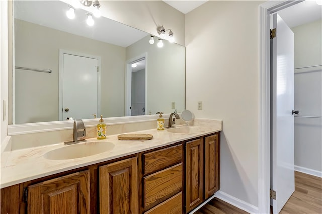 bathroom with vanity and hardwood / wood-style flooring