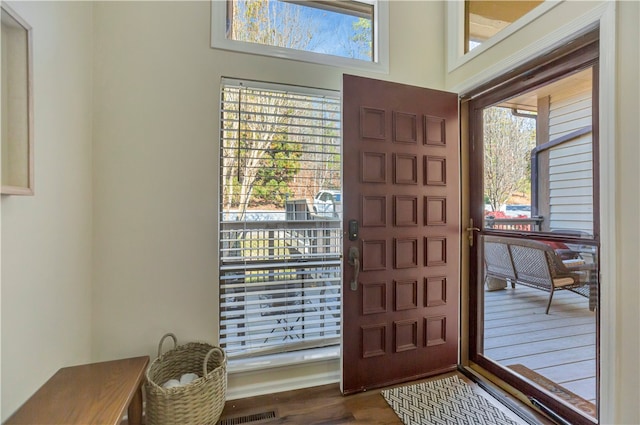 entryway with hardwood / wood-style flooring