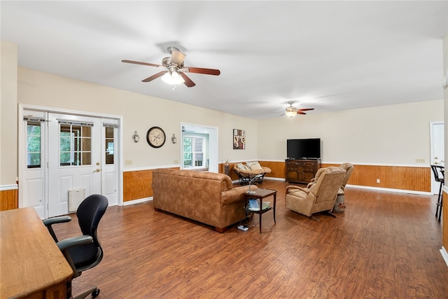 living room with hardwood / wood-style floors, ceiling fan, and a wealth of natural light