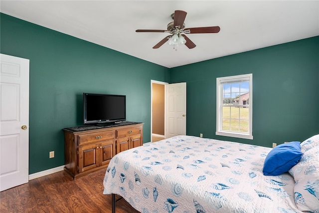 bedroom featuring ceiling fan and dark hardwood / wood-style flooring