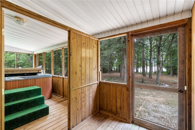 sunroom / solarium with plenty of natural light and wood ceiling