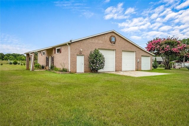 exterior space with a garage and a yard